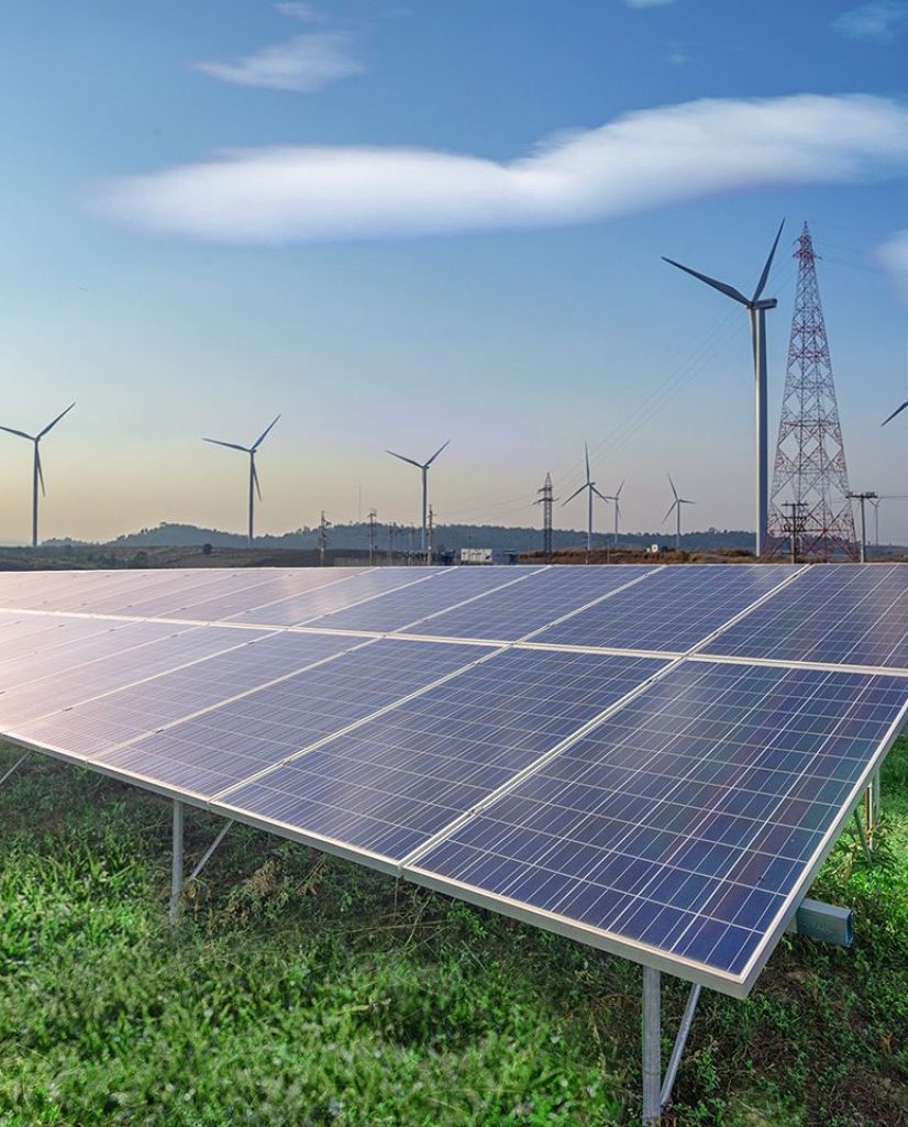 renewable-energy-solar-panels-wind-turbines-green-grass-blue-sky